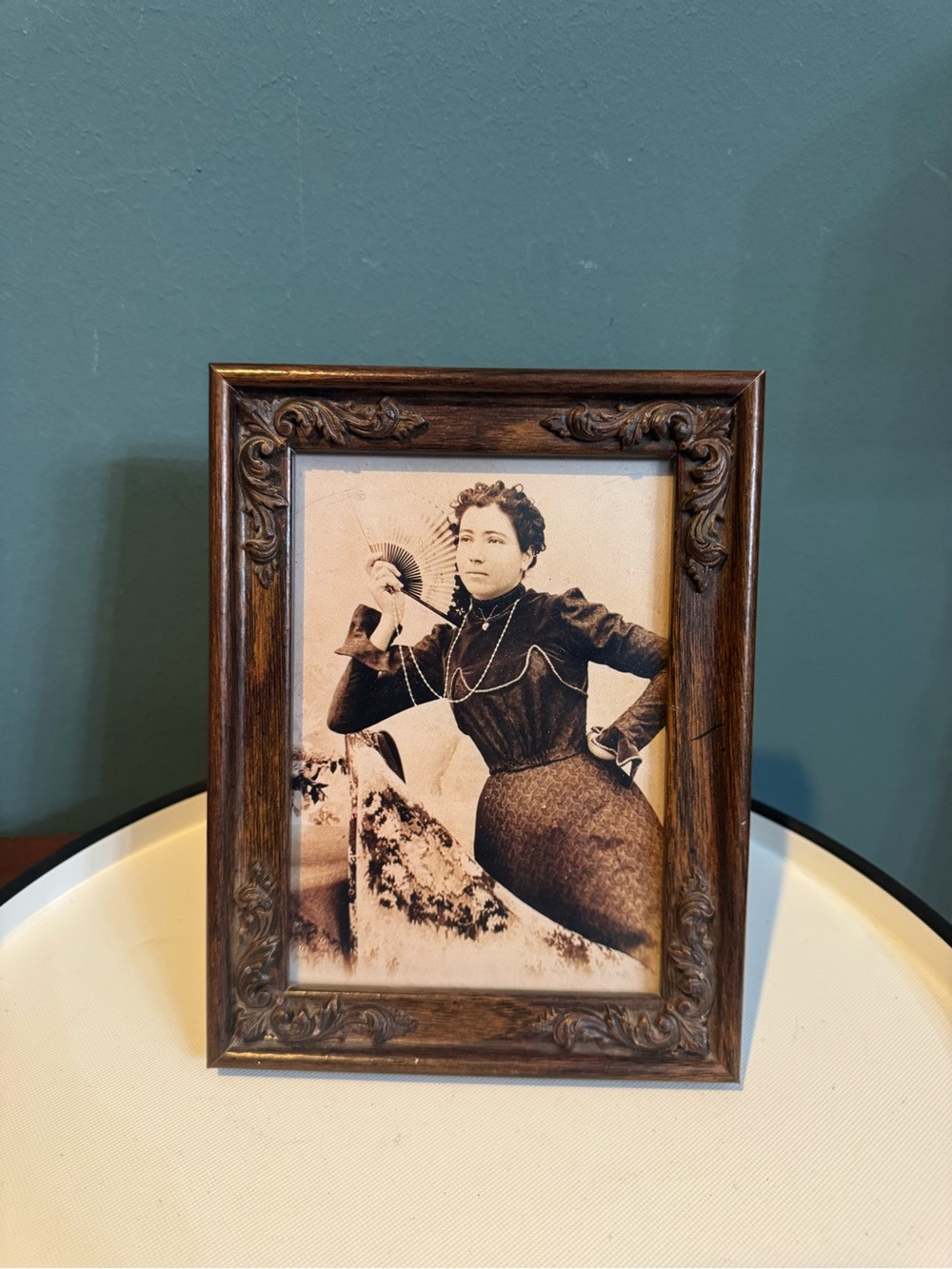 Framed photo of beautiful Victorian woman with fan and heart locket